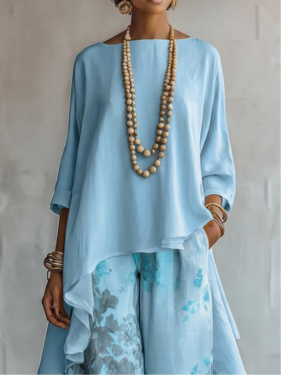Ensemble haut asymétrique bleu et pantalon large à fleurs