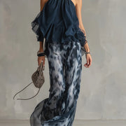 Ensemble haut halter bleu marine et pantalon large imprimé en mousseline