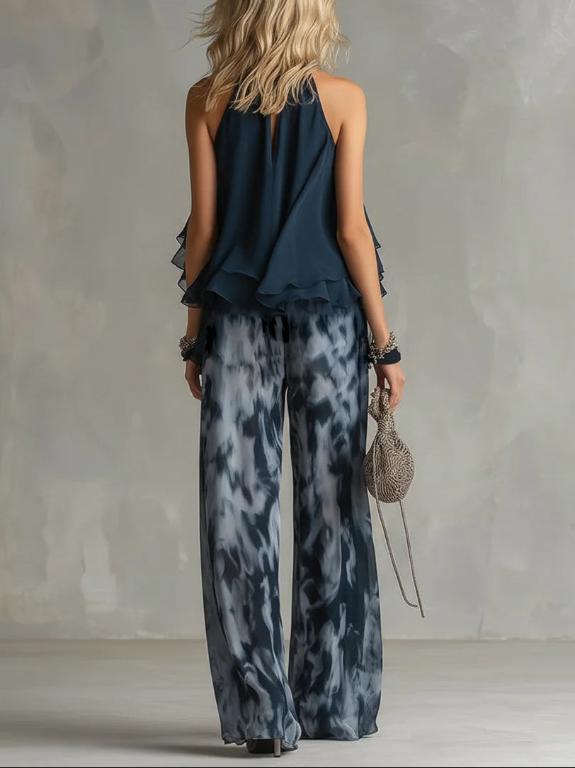 Ensemble haut halter bleu marine et pantalon large imprimé en mousseline