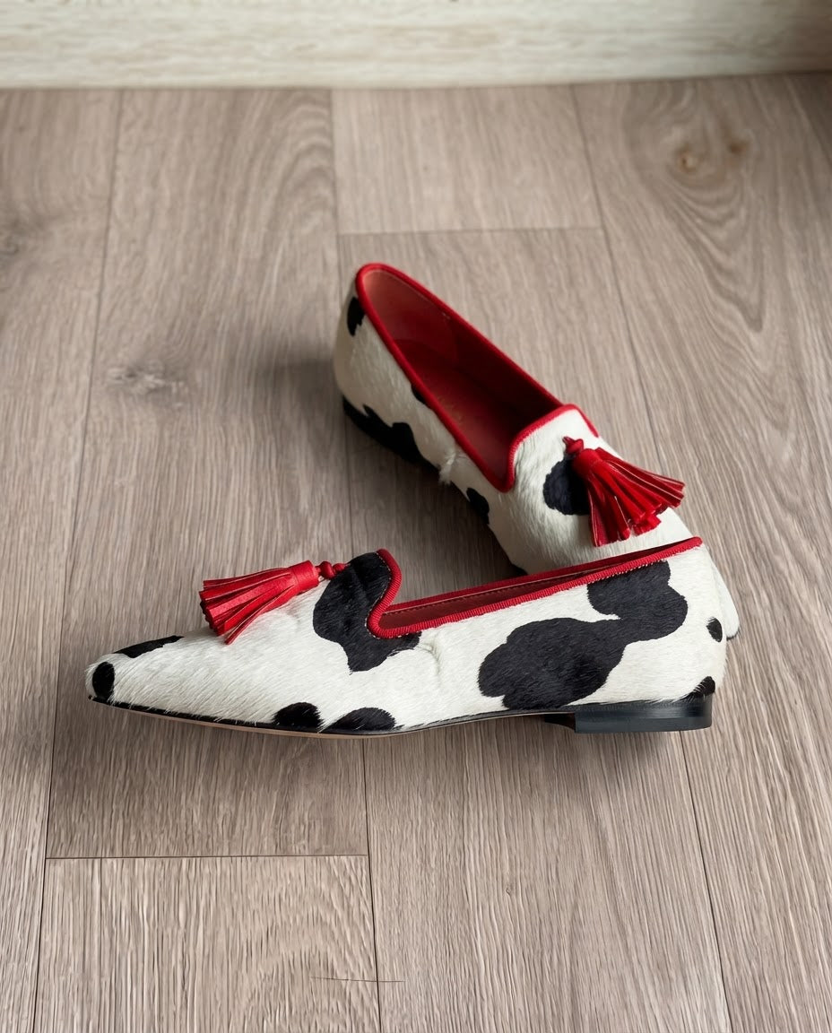Ginevra Mocassin — Imprimé vache noir et blanc, glands rouges